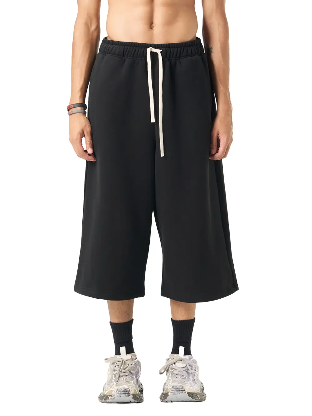 Model wearing the black Club Timor capri sweatpants